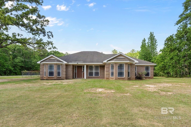 single story home with brick siding and a front lawn