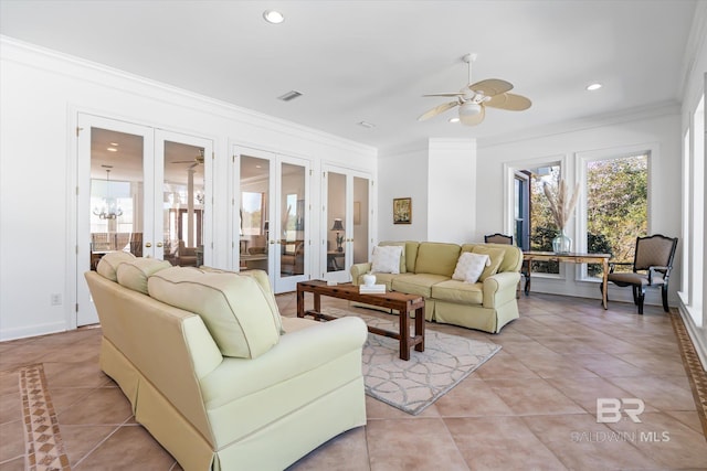 living room featuring visible vents, ornamental molding, light tile patterned floors, french doors, and a ceiling fan