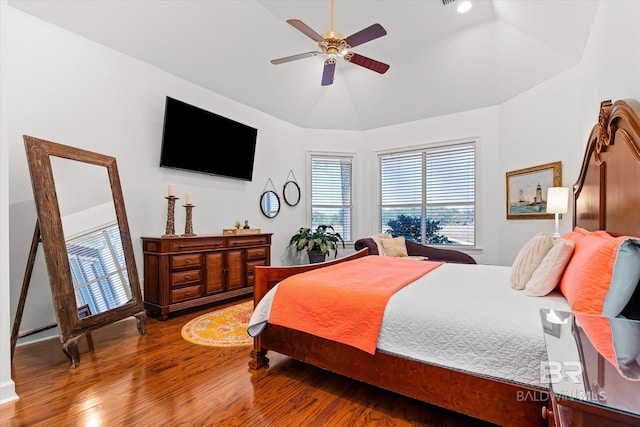 bedroom with lofted ceiling, wood finished floors, and ceiling fan