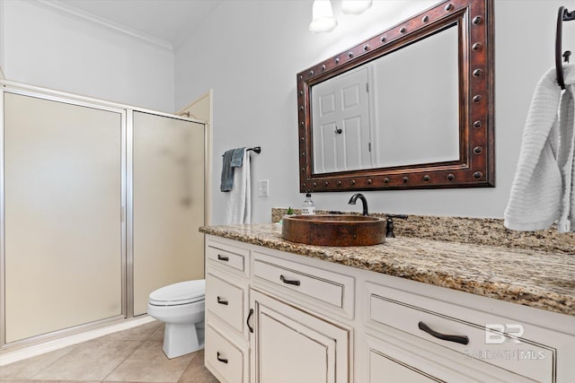 full bath featuring tile patterned flooring, toilet, ornamental molding, a stall shower, and vanity