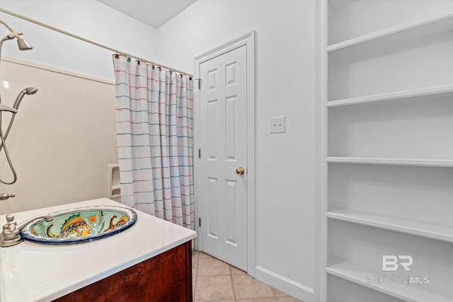 full bathroom with vanity and tile patterned floors