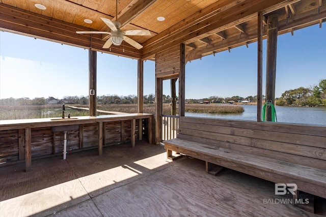 view of patio with a water view