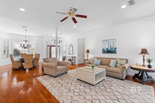 living room featuring recessed lighting, visible vents, light wood finished floors, and ceiling fan with notable chandelier