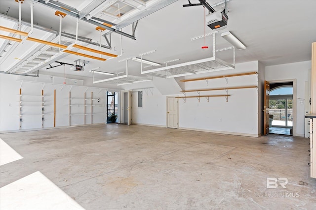 garage with electric panel and a garage door opener