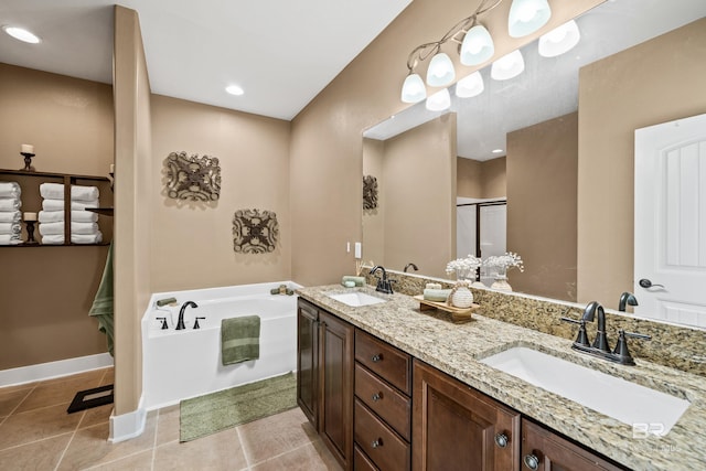 full bathroom featuring a sink, a stall shower, a bath, and tile patterned flooring