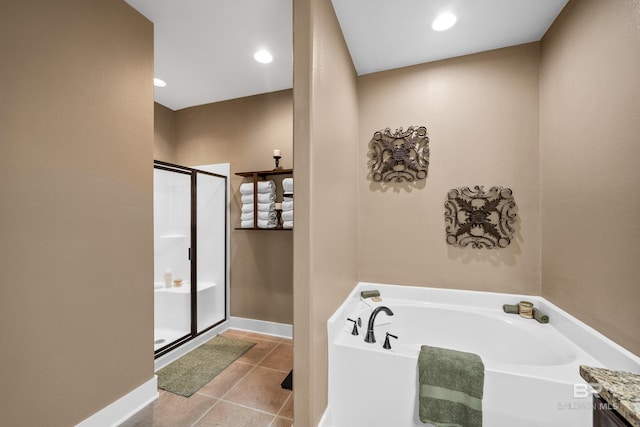 bathroom with a stall shower, recessed lighting, tile patterned flooring, baseboards, and a bath