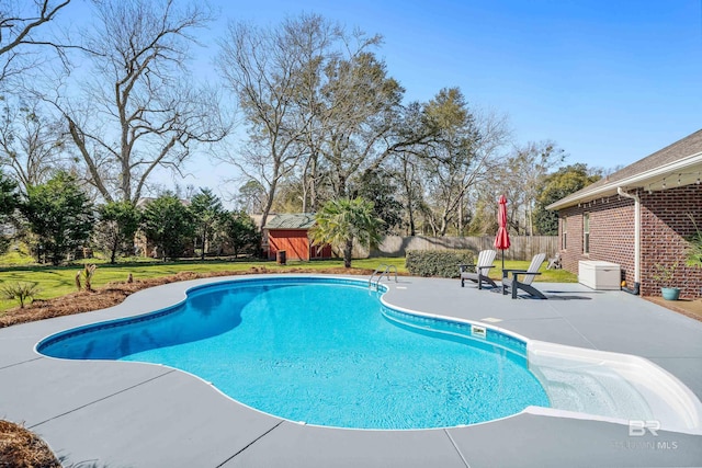 view of pool with a yard, a patio area, a fenced in pool, and a fenced backyard