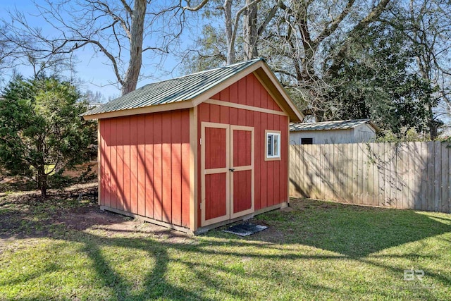 view of shed with fence