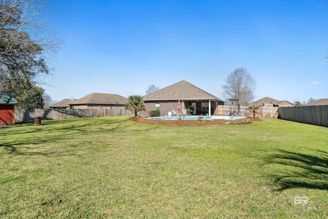 view of yard featuring a gazebo, a fenced backyard, and a fenced in pool