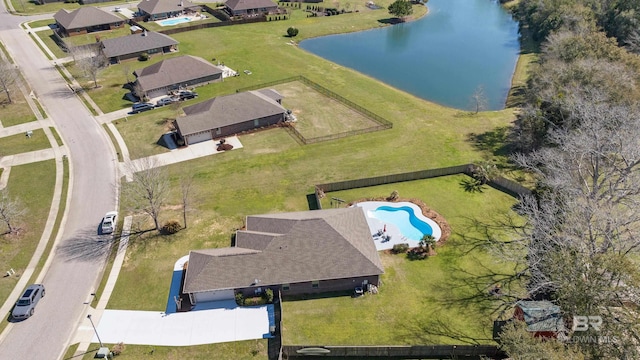 birds eye view of property with a water view