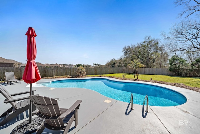 view of swimming pool with a fenced in pool, a yard, a fenced backyard, and a patio area