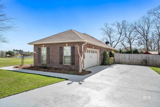 view of side of home with fence, an attached garage, concrete driveway, a lawn, and brick siding