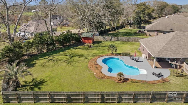 view of pool with a lawn, a patio, a fenced backyard, and a fenced in pool