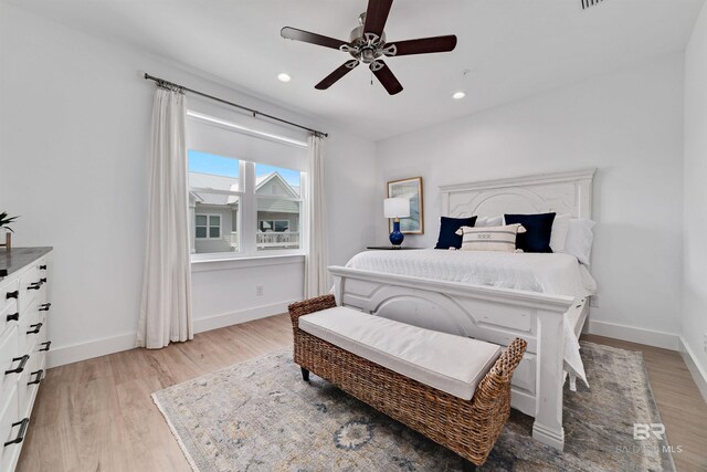 bedroom featuring ceiling fan and light hardwood / wood-style floors