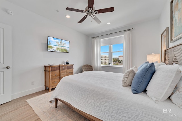 bedroom featuring light hardwood / wood-style floors and ceiling fan