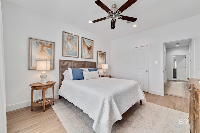 bedroom featuring ceiling fan and light hardwood / wood-style floors