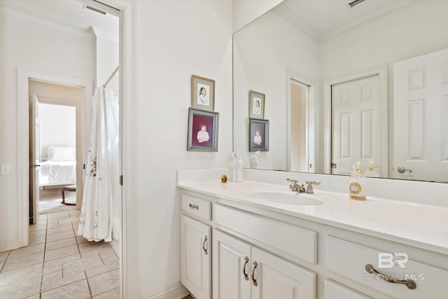 full bath featuring ornamental molding, vanity, and baseboards