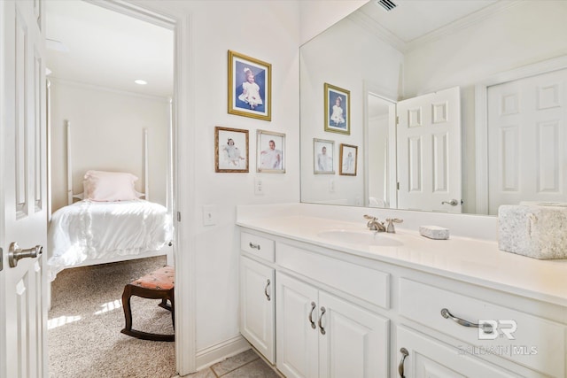 bathroom featuring connected bathroom, crown molding, vanity, and baseboards