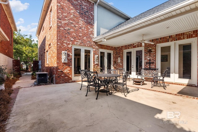 view of patio / terrace featuring fence, a ceiling fan, and french doors