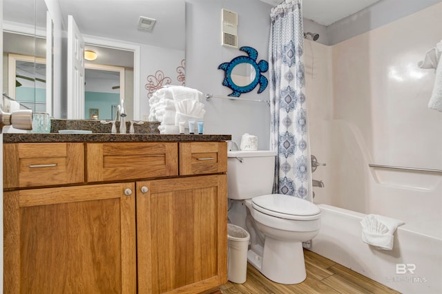 full bathroom featuring toilet, vanity, shower / bath combination with curtain, and wood-type flooring