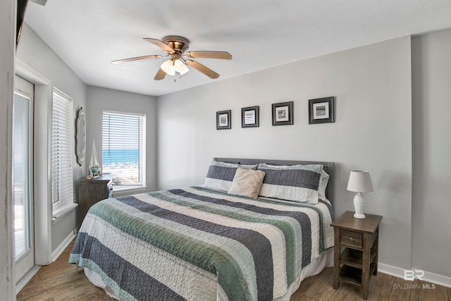 bedroom featuring hardwood / wood-style flooring and ceiling fan