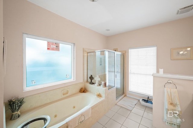 bathroom with plus walk in shower and tile patterned flooring