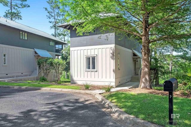 view of front facade featuring board and batten siding and entry steps