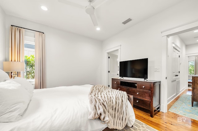 bedroom featuring wood finished floors, recessed lighting, and a ceiling fan
