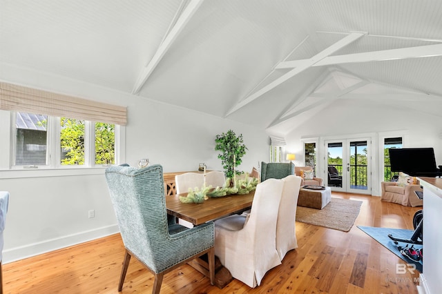 dining room with plenty of natural light, wood finished floors, and baseboards