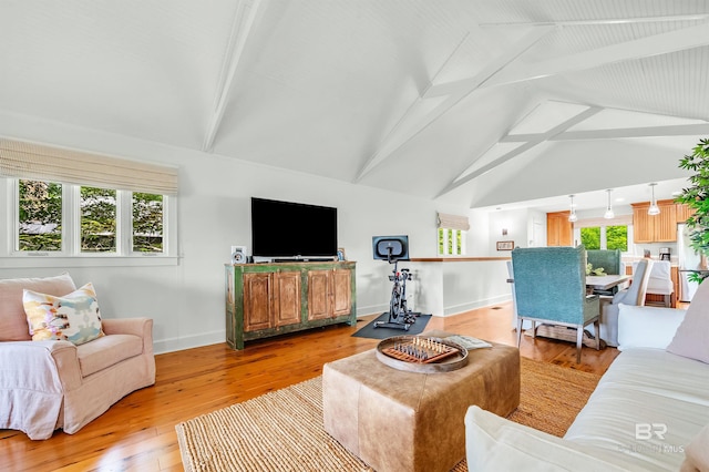 living room featuring baseboards and light wood-type flooring