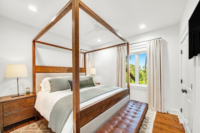 bedroom with wood finished floors and recessed lighting