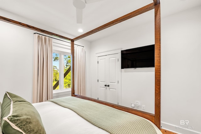 bedroom featuring recessed lighting, baseboards, ceiling fan, a closet, and wood finished floors