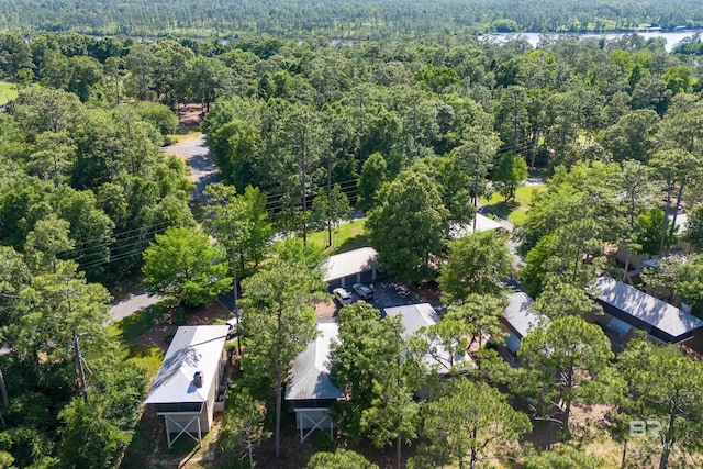 aerial view of property and surrounding area with a forest