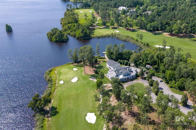 view of property location featuring a large body of water and a golf club