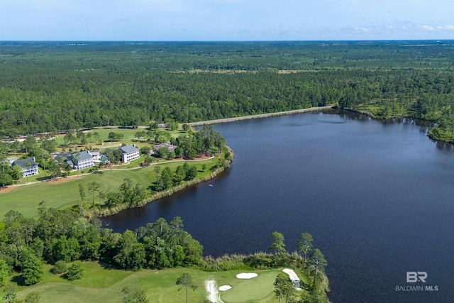aerial view of property and surrounding area featuring a forest, a large body of water, and a golf club
