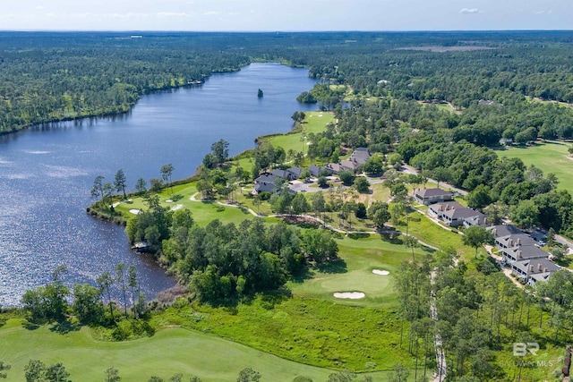 aerial view of property's location featuring a large body of water, a forest, a golf club, and nearby suburban area