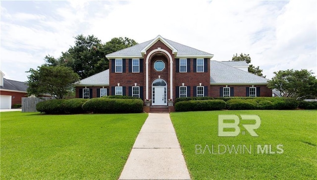 1140 E Dominion Dr, Mobile, AL 36695 - view of front facade with a front lawn and brick siding
