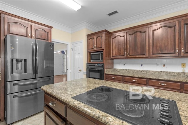 1140 E Dominion Dr, Mobile, AL 36695 - kitchen featuring black appliances, light stone counters, ornamental molding, and backsplash