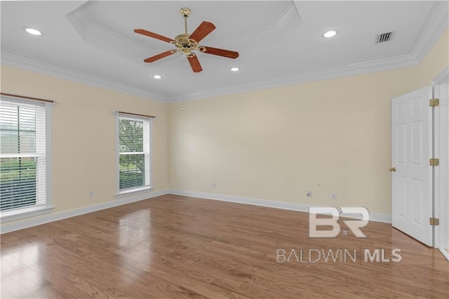 1140 E Dominion Dr, Mobile, AL 36695 - empty room featuring crown molding, wood finished floors, ceiling fan, a raised ceiling, and recessed lighting