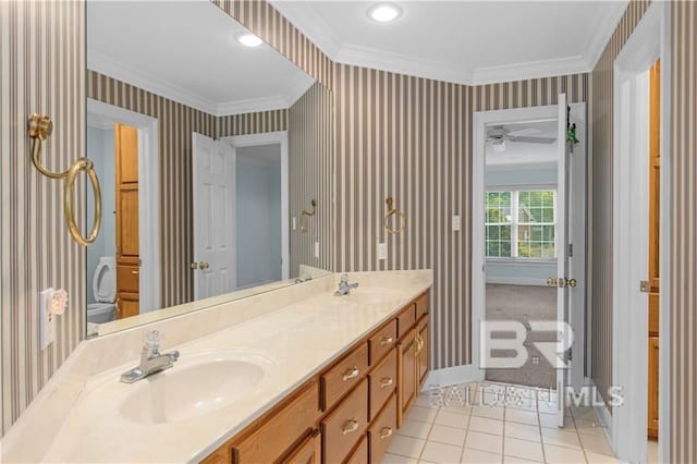 1140 E Dominion Dr, Mobile, AL 36695 - bathroom with double vanity, wallpapered walls, ornamental molding, tile patterned floors, and ceiling fan