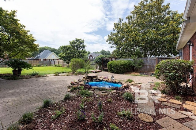 1140 E Dominion Dr, Mobile, AL 36695 - fenced backyard featuring a patio area