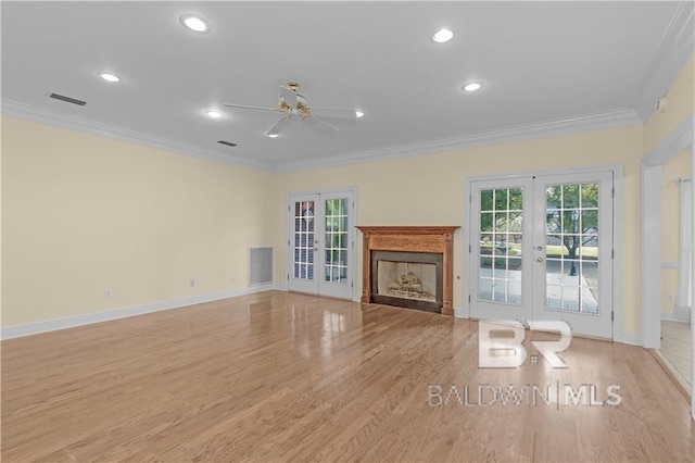1140 E Dominion Dr, Mobile, AL 36695 - unfurnished living room with french doors, ceiling fan, crown molding, plenty of natural light, and light wood-type flooring
