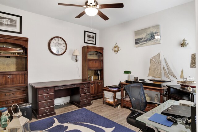 office area featuring light wood finished floors and ceiling fan