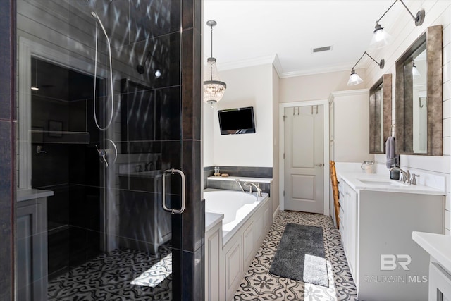 14281 Timber Ridge Dr, Loxley, AL 36551 - bathroom with vanity, ornamental molding, a stall shower, a garden tub, and tile patterned floors
