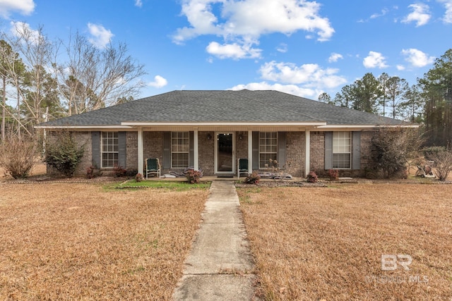 ranch-style house with a front lawn and a porch