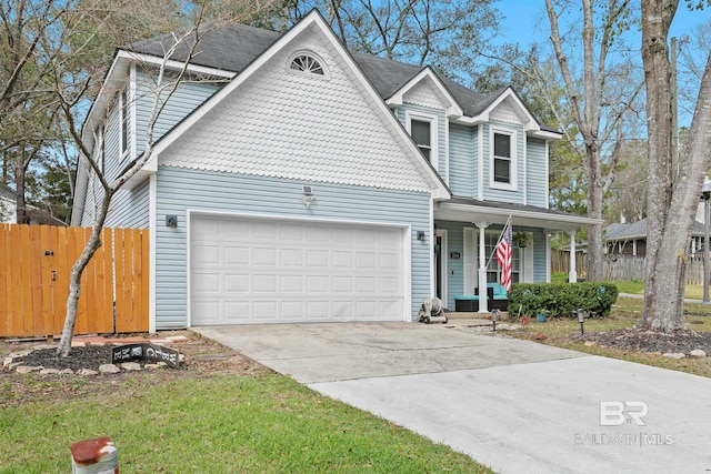 view of front property featuring covered porch and a garage