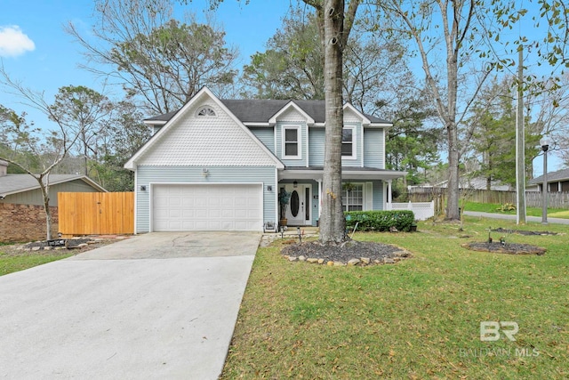 view of front of house featuring a front lawn and a garage