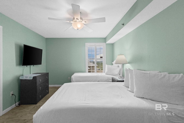 24132 Perdido Beach Blvd Unit 1081, Orange Beach, AL 36561 - bedroom with baseboards and ceiling fan