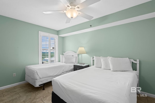 24132 Perdido Beach Blvd Unit 1081, Orange Beach, AL 36561 - bedroom with baseboards and ceiling fan