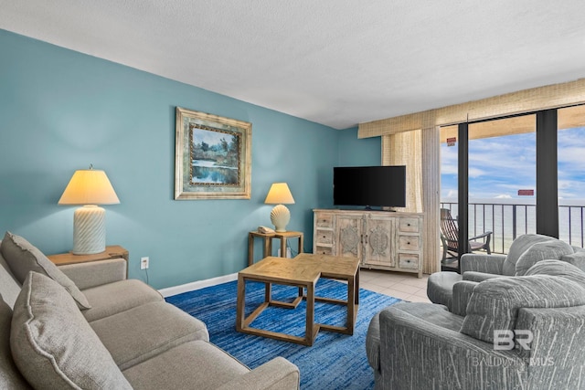 24132 Perdido Beach Blvd Unit 1081, Orange Beach, AL 36561 - tiled living area featuring a textured ceiling and baseboards